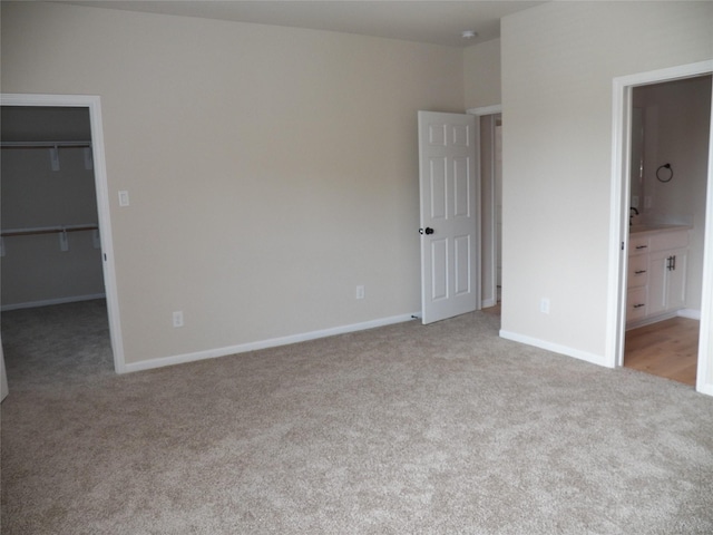 4218 Sorsby Dr, Houston, TX 77047 - unfurnished bedroom featuring carpet floors, a spacious closet, a closet, and ensuite bath