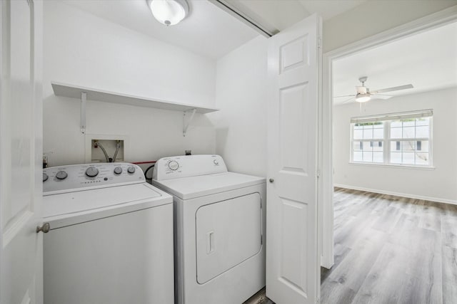 6451 Olympia Dr Unit 96, Houston, TX 77057 - laundry room with washer and clothes dryer, ceiling fan, and light wood-style flooring