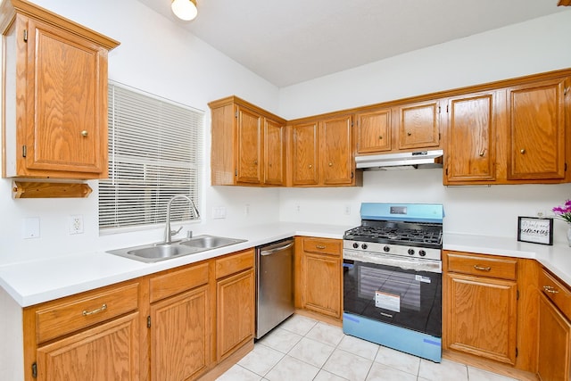 9338 Corner Oak Ln, Houston, TX 77036 - kitchen with appliances with stainless steel finishes, under cabinet range hood, light countertops, and light tile patterned flooring