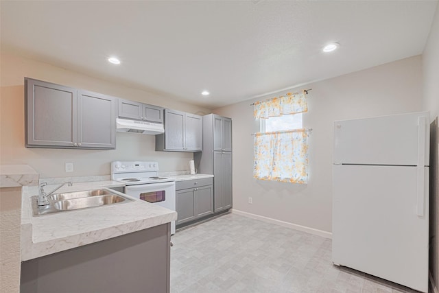 530 Frankie St Unit 1, Houston, TX 77015 - kitchen featuring white appliances, under cabinet range hood, gray cabinets, light countertops, and recessed lighting