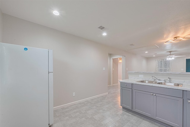 530 Frankie St Unit 1, Houston, TX 77015 - kitchen with freestanding refrigerator, gray cabinetry, light countertops, ceiling fan, and recessed lighting