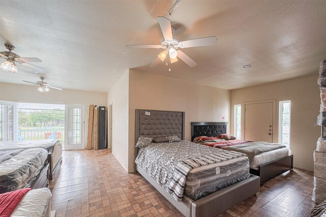 530 Frankie St Unit 1, Houston, TX 77015 - bedroom featuring access to outside, a textured ceiling, and a ceiling fan