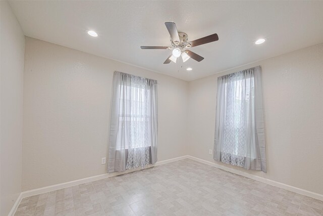 530 Frankie St Unit 1, Houston, TX 77015 - spare room with ceiling fan, recessed lighting, and tile patterned floors