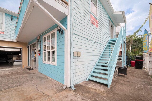 530 Frankie St Unit 1, Houston, TX 77015 - view of side of property with stairway, driveway, and a garage