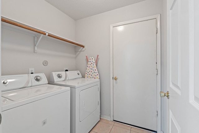 15506 Elm Leaf Pl, Cypress, TX 77429 - laundry area featuring washer and dryer and light tile patterned floors