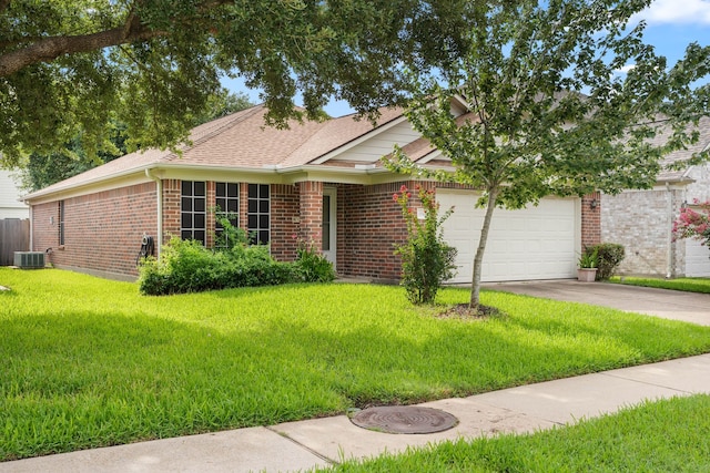 15506 Elm Leaf Pl, Cypress, TX 77429 - view of front of property featuring brick siding, a garage, a front lawn, driveway, and roof with shingles
