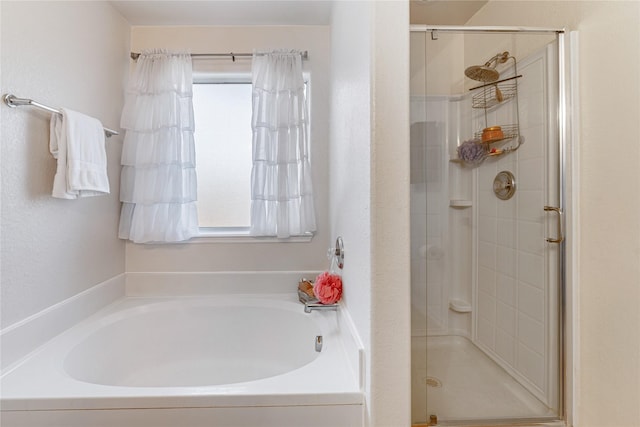 2830 Katybriar Ln, Katy, TX 77449 - full bathroom with healthy amount of natural light, a stall shower, and a garden tub