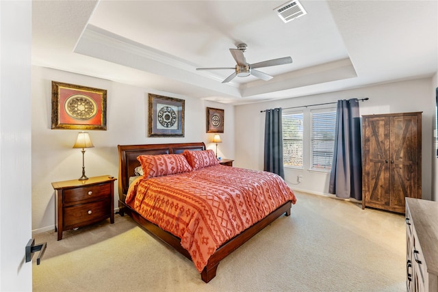 2830 Katybriar Ln, Katy, TX 77449 - bedroom with a tray ceiling, light carpet, and a ceiling fan