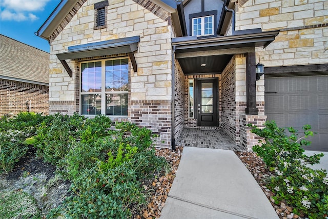 3310 Bellwick Chase Ln, Houston, TX 77365 - property entrance with stone siding and a garage