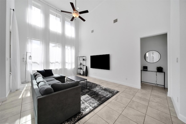 3310 Bellwick Chase Ln, Houston, TX 77365 - living room featuring a high ceiling, ceiling fan, and light tile patterned flooring