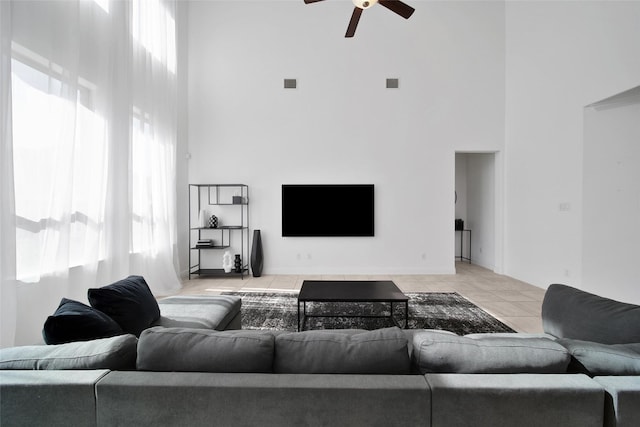 3310 Bellwick Chase Ln, Houston, TX 77365 - living area with a high ceiling, light tile patterned flooring, and ceiling fan
