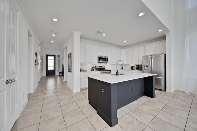 3310 Bellwick Chase Ln, Houston, TX 77365 - kitchen featuring stainless steel appliances, light tile patterned flooring, white cabinets, light countertops, and recessed lighting