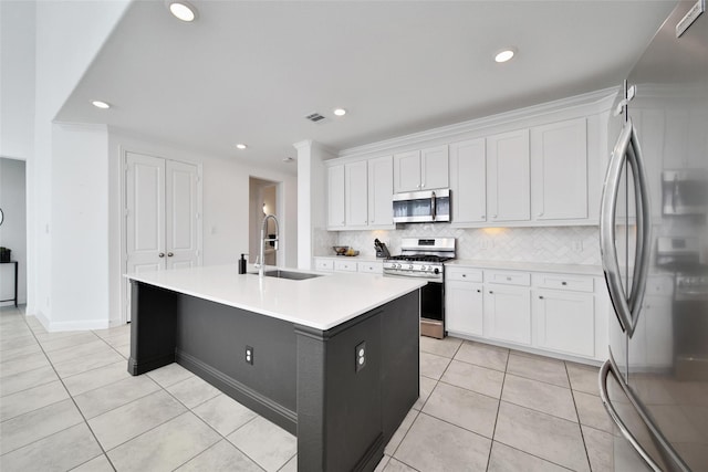 3310 Bellwick Chase Ln, Houston, TX 77365 - kitchen with appliances with stainless steel finishes, light tile patterned flooring, white cabinets, and recessed lighting