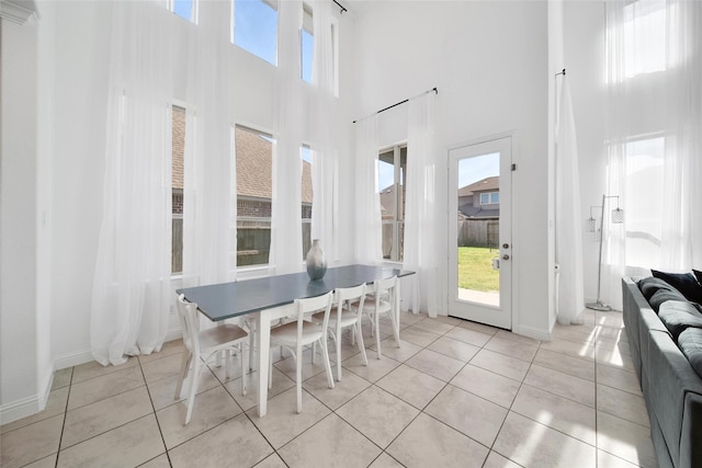 3310 Bellwick Chase Ln, Houston, TX 77365 - dining area with a high ceiling, plenty of natural light, and light tile patterned flooring