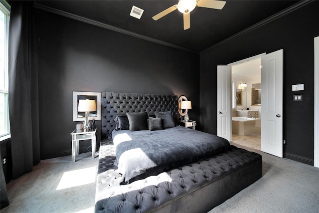 3310 Bellwick Chase Ln, Houston, TX 77365 - carpeted bedroom with ornamental molding, ensuite bath, and ceiling fan