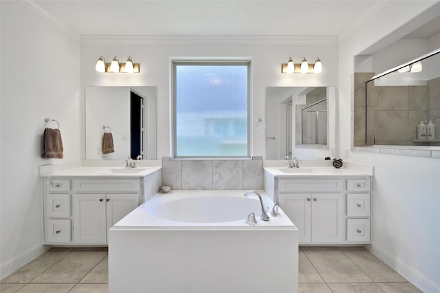 3310 Bellwick Chase Ln, Houston, TX 77365 - full bath with a bath, tile patterned floors, two vanities, and ornamental molding