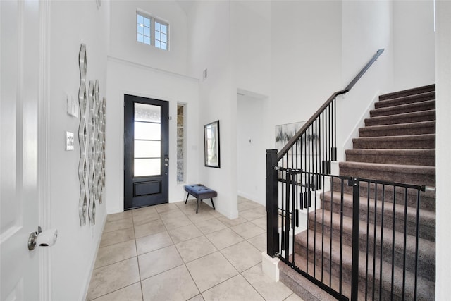 3310 Bellwick Chase Ln, Houston, TX 77365 - entrance foyer with stairway, a high ceiling, and light tile patterned floors