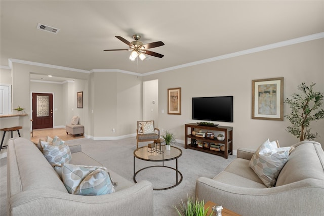207 Cattle Ranch Dr, Richmond, TX 77469 - living area with light colored carpet, crown molding, and ceiling fan