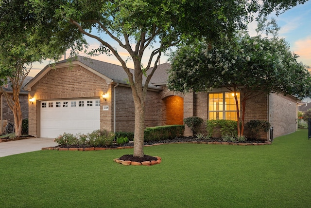 207 Cattle Ranch Dr, Richmond, TX 77469 - single story home featuring brick siding, an attached garage, a lawn, and concrete driveway