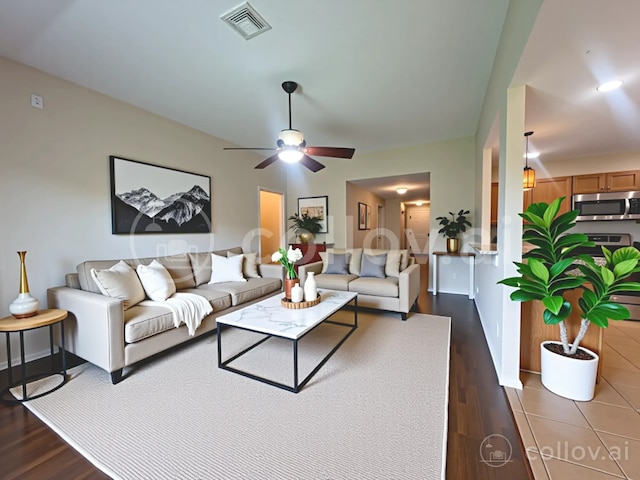13693 Bighorn Trl, Willis, TX 77378 - living area featuring ceiling fan and dark wood finished floors