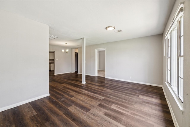 3209 Mccrarey Dr, Houston, TX 77088 - unfurnished room featuring a chandelier and dark wood finished floors