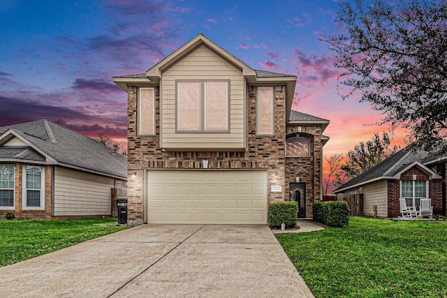 12222 Warrenwood Dr, Houston, TX 77066 - view of front of home with driveway, an attached garage, a front lawn, and brick siding