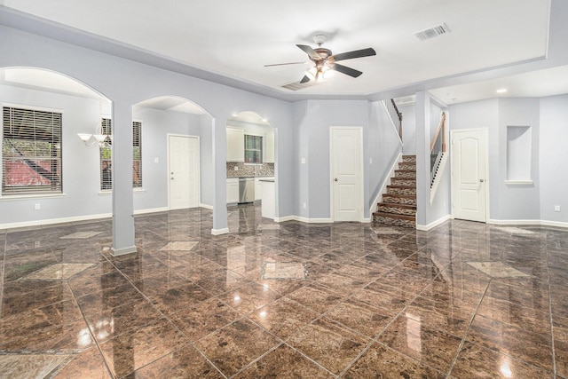 12222 Warrenwood Dr, Houston, TX 77066 - unfurnished living room with granite tiled floors, a ceiling fan, stairs, and arched walkways