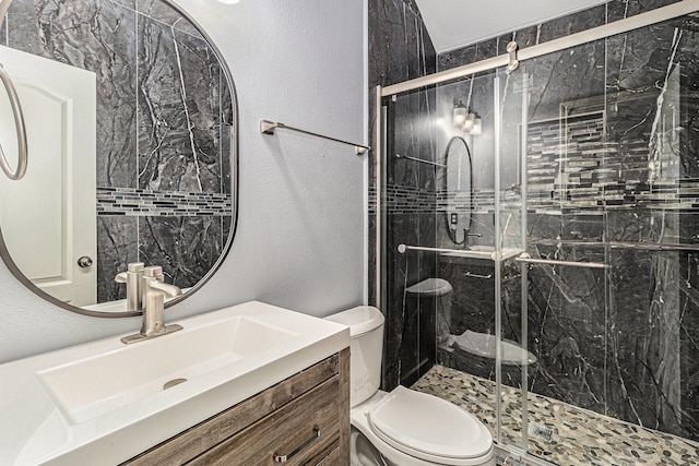 12222 Warrenwood Dr, Houston, TX 77066 - bathroom with a shower stall, vanity, and a textured wall