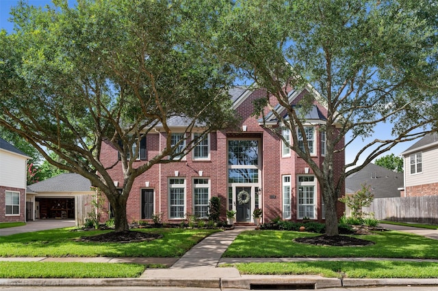 16047 Lockdale Ln, Cypress, TX 77429 - view of front of property featuring brick siding and a detached garage