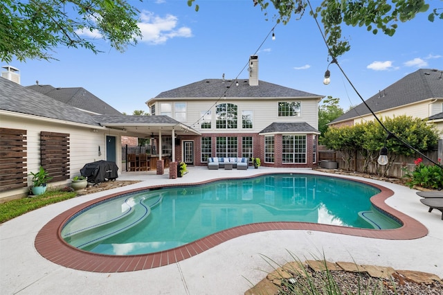 16047 Lockdale Ln, Cypress, TX 77429 - view of swimming pool featuring an outdoor hangout area, a fenced backyard, a patio, a ceiling fan, and grilling area