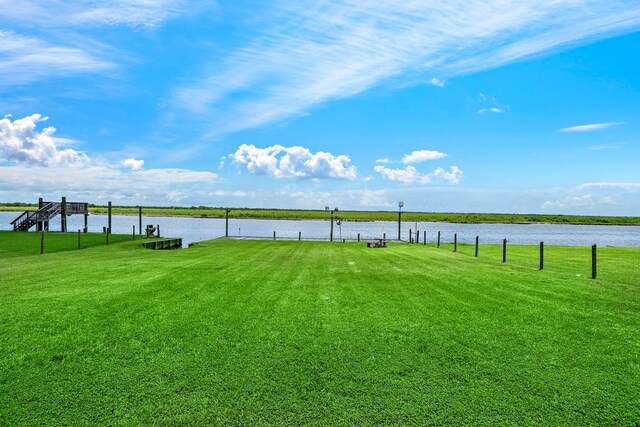 10102 S Redfish Dr, Hitchcock, TX 77563 - view of grassy yard featuring a water view