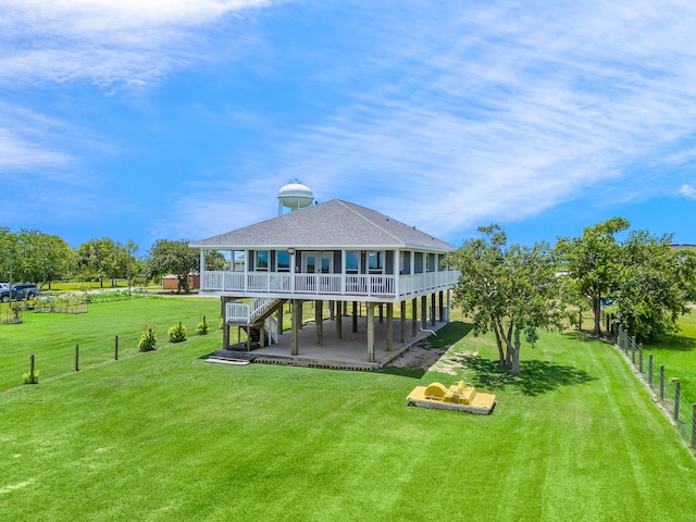 10102 S Redfish Dr, Hitchcock, TX 77563 - back of property with a patio area, a shingled roof, a deck, and stairway