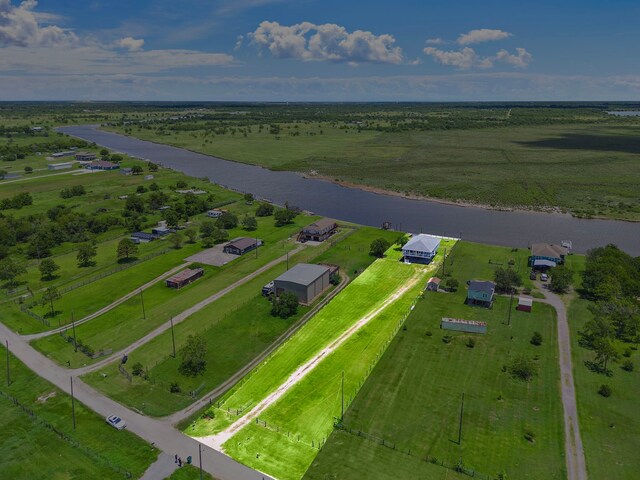 10102 S Redfish Dr, Hitchcock, TX 77563 - aerial view of sparsely populated area featuring a nearby body of water