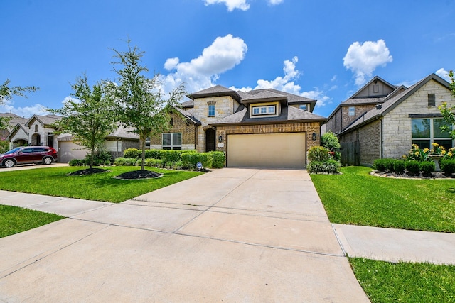 14618 Moccasin Ridge Dr, Cypress, TX 77433 - view of front of house with concrete driveway, a garage, a front yard, and brick siding