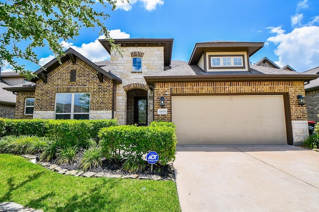 14618 Moccasin Ridge Dr, Cypress, TX 77433 - french country home with concrete driveway, brick siding, an attached garage, and stone siding