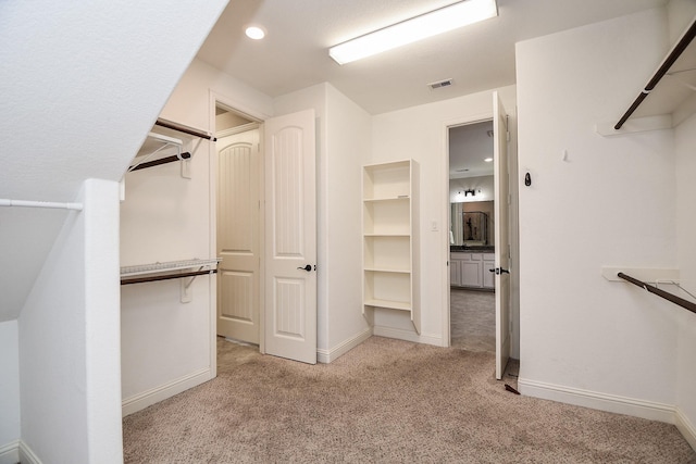 14618 Moccasin Ridge Dr, Cypress, TX 77433 - walk in closet featuring light carpet