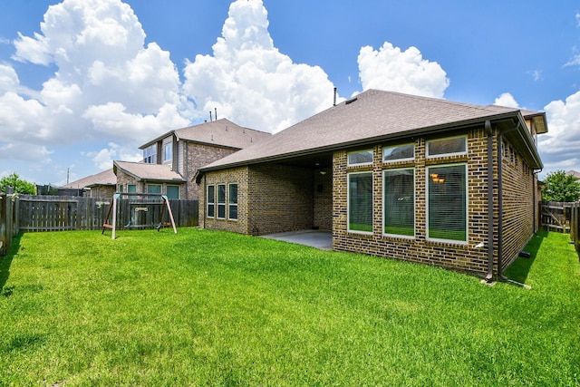 14618 Moccasin Ridge Dr, Cypress, TX 77433 - rear view of property featuring brick siding, a fenced backyard, a patio area, and a shingled roof