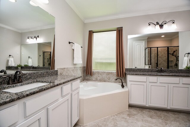 14618 Moccasin Ridge Dr, Cypress, TX 77433 - bathroom featuring two vanities, a bath, a shower stall, and crown molding