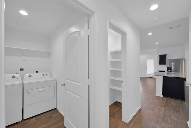 21391 Owl Rd, New Caney, TX 77357 - laundry room with washing machine and clothes dryer, dark wood finished floors, and recessed lighting