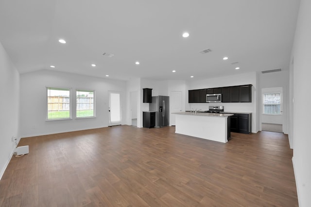 21391 Owl Rd, New Caney, TX 77357 - unfurnished living room with healthy amount of natural light, recessed lighting, and dark wood-style floors