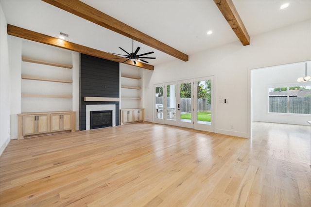 1419 Candlelight Ln, Houston, TX 77018 - unfurnished living room with a large fireplace, beamed ceiling, healthy amount of natural light, light wood finished floors, and ceiling fan