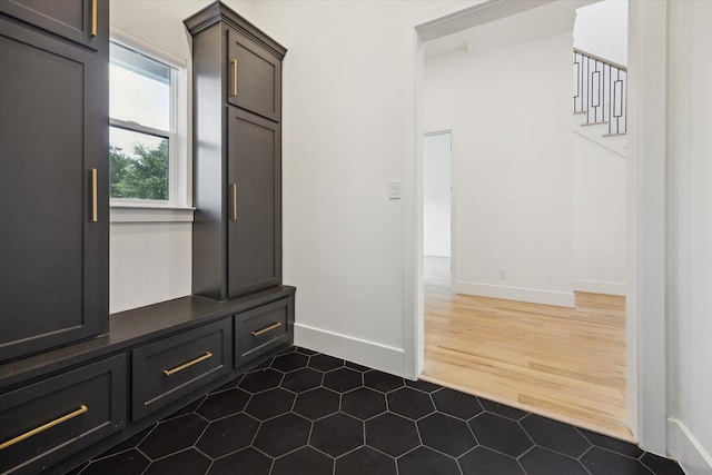 1419 Candlelight Ln, Houston, TX 77018 - mudroom featuring baseboards and dark wood-type flooring