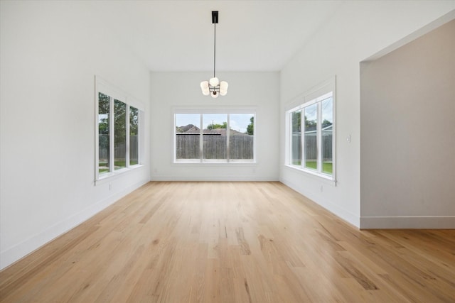 1419 Candlelight Ln, Houston, TX 77018 - unfurnished dining area with a chandelier and light wood-style floors