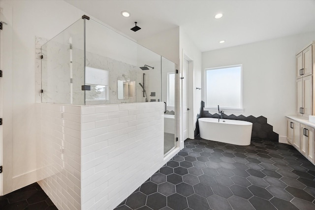 1419 Candlelight Ln, Houston, TX 77018 - bathroom featuring a marble finish shower, a freestanding bath, recessed lighting, vanity, and tile patterned floors