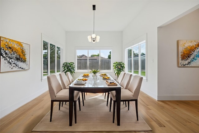 1419 Candlelight Ln, Houston, TX 77018 - dining area with light wood-style flooring and a chandelier
