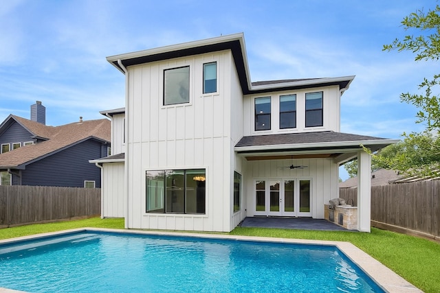 1419 Candlelight Ln, Houston, TX 77018 - rear view of property featuring ceiling fan, french doors, a fenced backyard, and board and batten siding