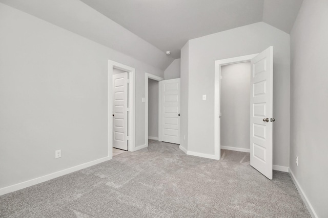 11106 Crocus Dr, Houston, TX 77044 - unfurnished bedroom featuring vaulted ceiling and light carpet