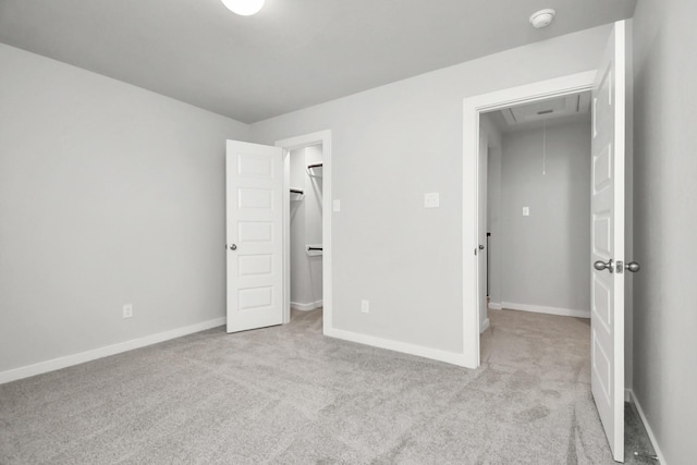 11106 Crocus Dr, Houston, TX 77044 - unfurnished bedroom with attic access, light colored carpet, and a walk in closet
