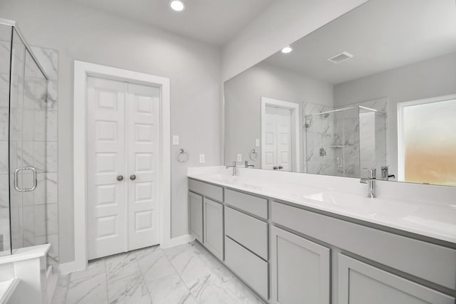 11106 Crocus Dr, Houston, TX 77044 - full bathroom featuring double vanity, a marble finish shower, marble finish floors, and recessed lighting