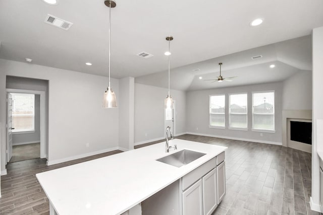 11106 Crocus Dr, Houston, TX 77044 - kitchen with light wood finished floors, plenty of natural light, open floor plan, light countertops, and recessed lighting